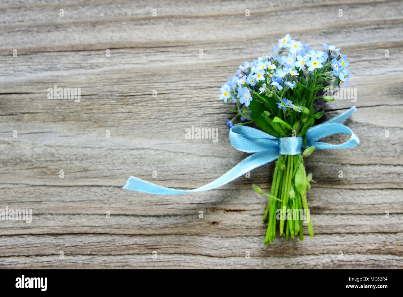 Blue ribbon flower bouquet hi-res stock photography and images - Alamy