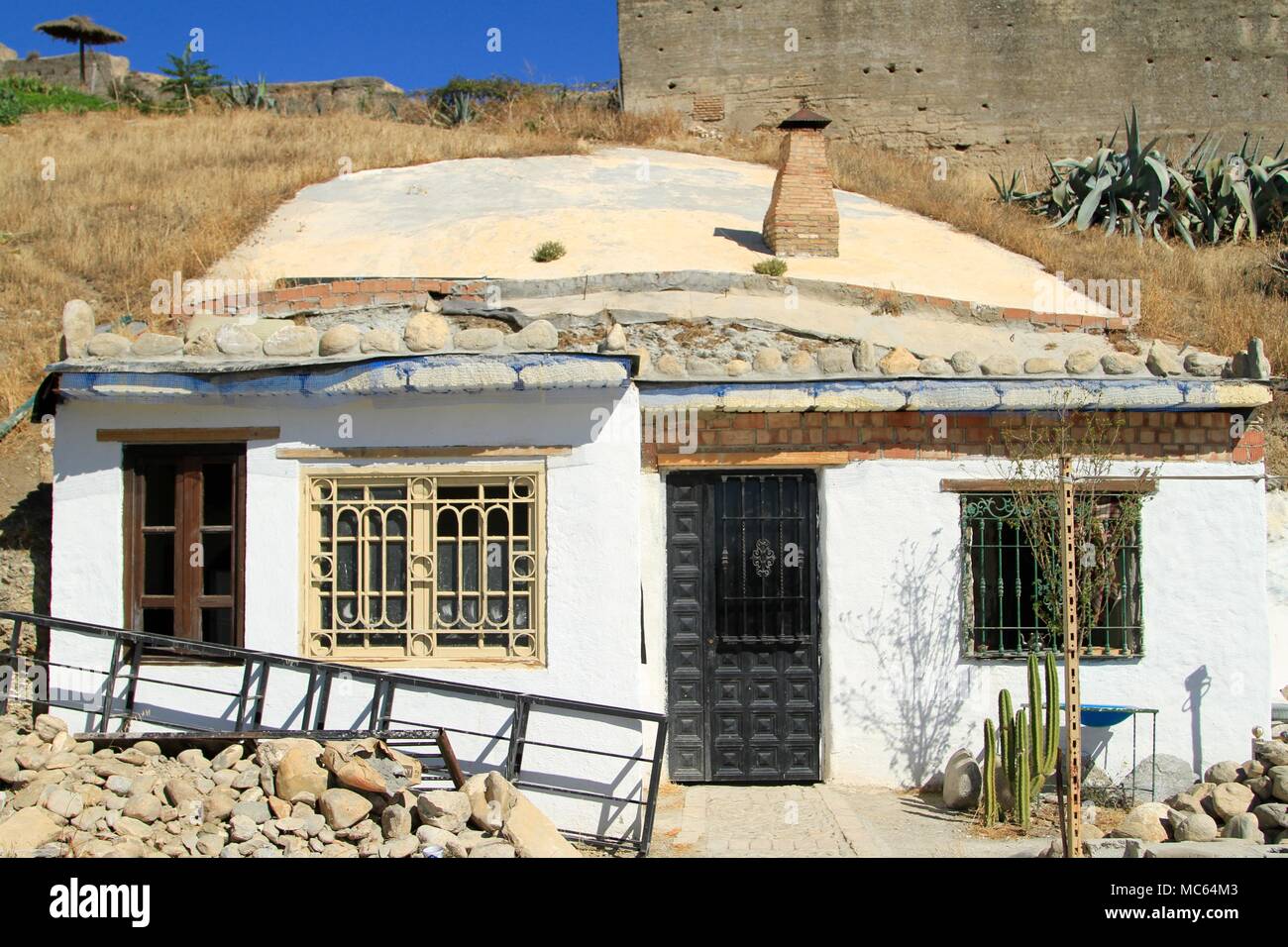 Facade of a modern Cave House in the Sacromonte neighborhood of Granada, Spain Stock Photo