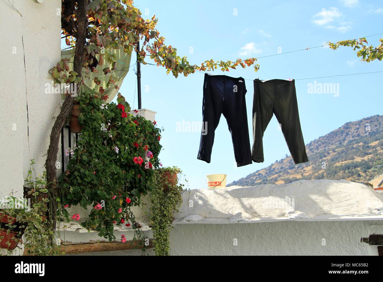 Pants hanging on a clothes line in a Spanish Village, Las Alpujarras, Andalusia, Spain, Europe Stock Photo
