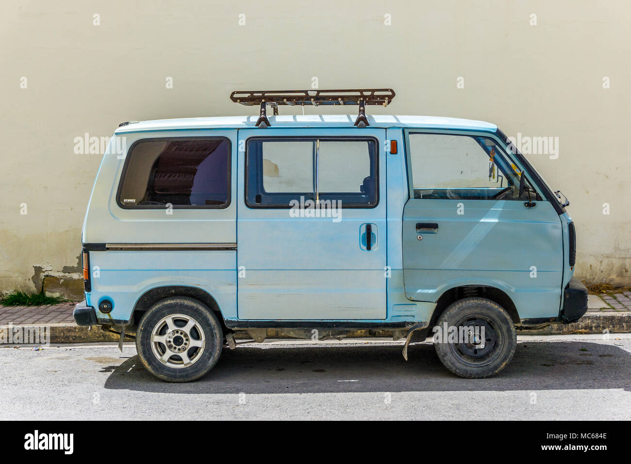 An old blue mini van parked in the street in St Pauls Bay, Malta, Europe  Stock Photo - Alamy