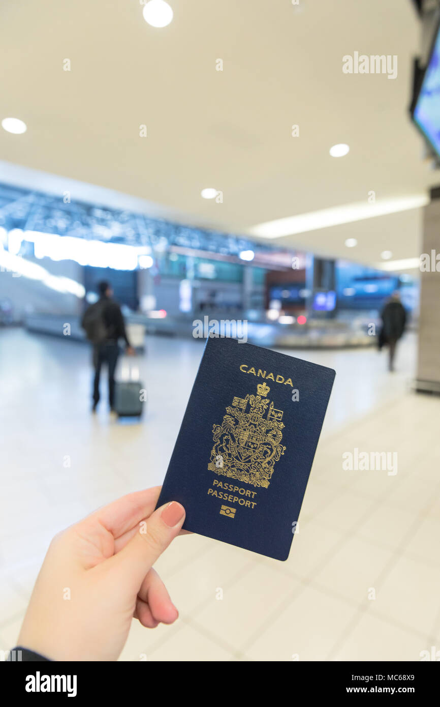 Canadian Passport closeup inside airport Stock Photo