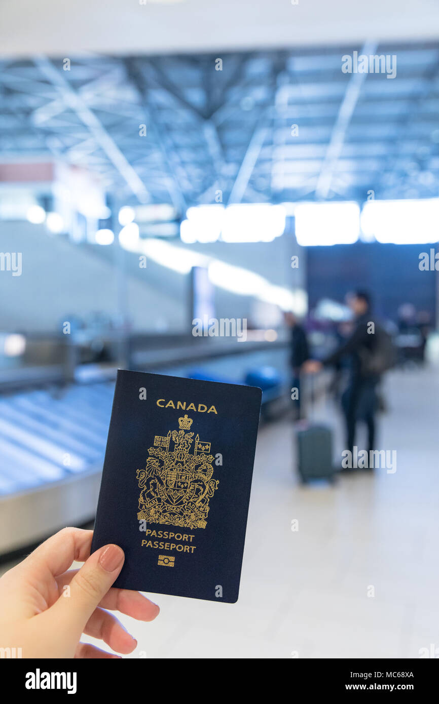 Canadian Passport closeup inside airport Stock Photo
