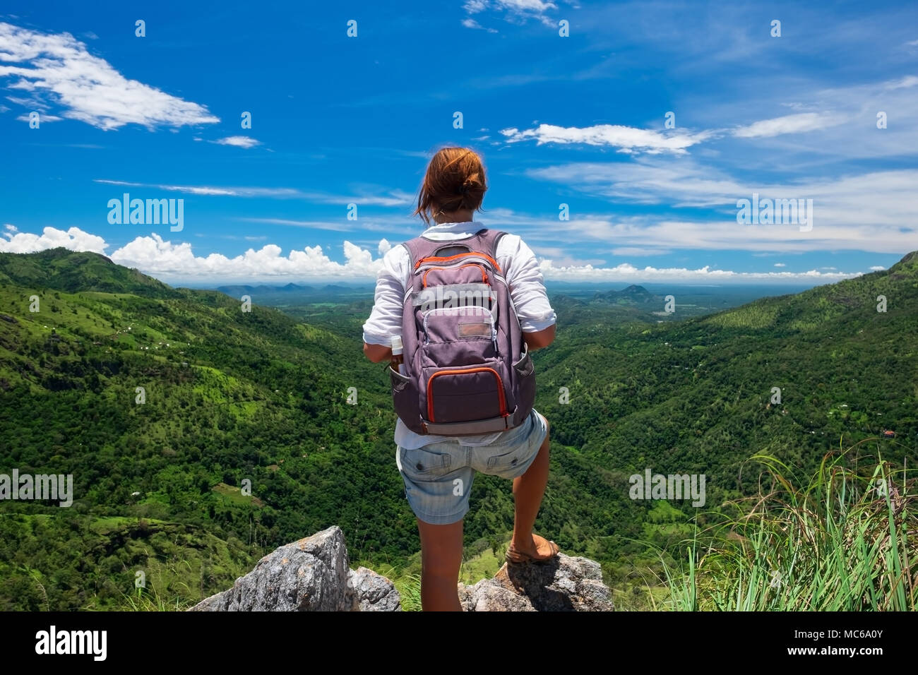 Caucasian girl stand to watch landscape from mini Adams peak Stock Photo