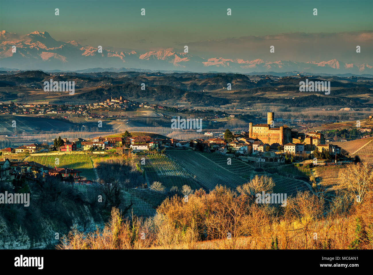 Panorama on the Langhe with Castiglione Falletto and its castle, further back the town of Roddi and, in the background, the circle of the Alps. Stock Photo