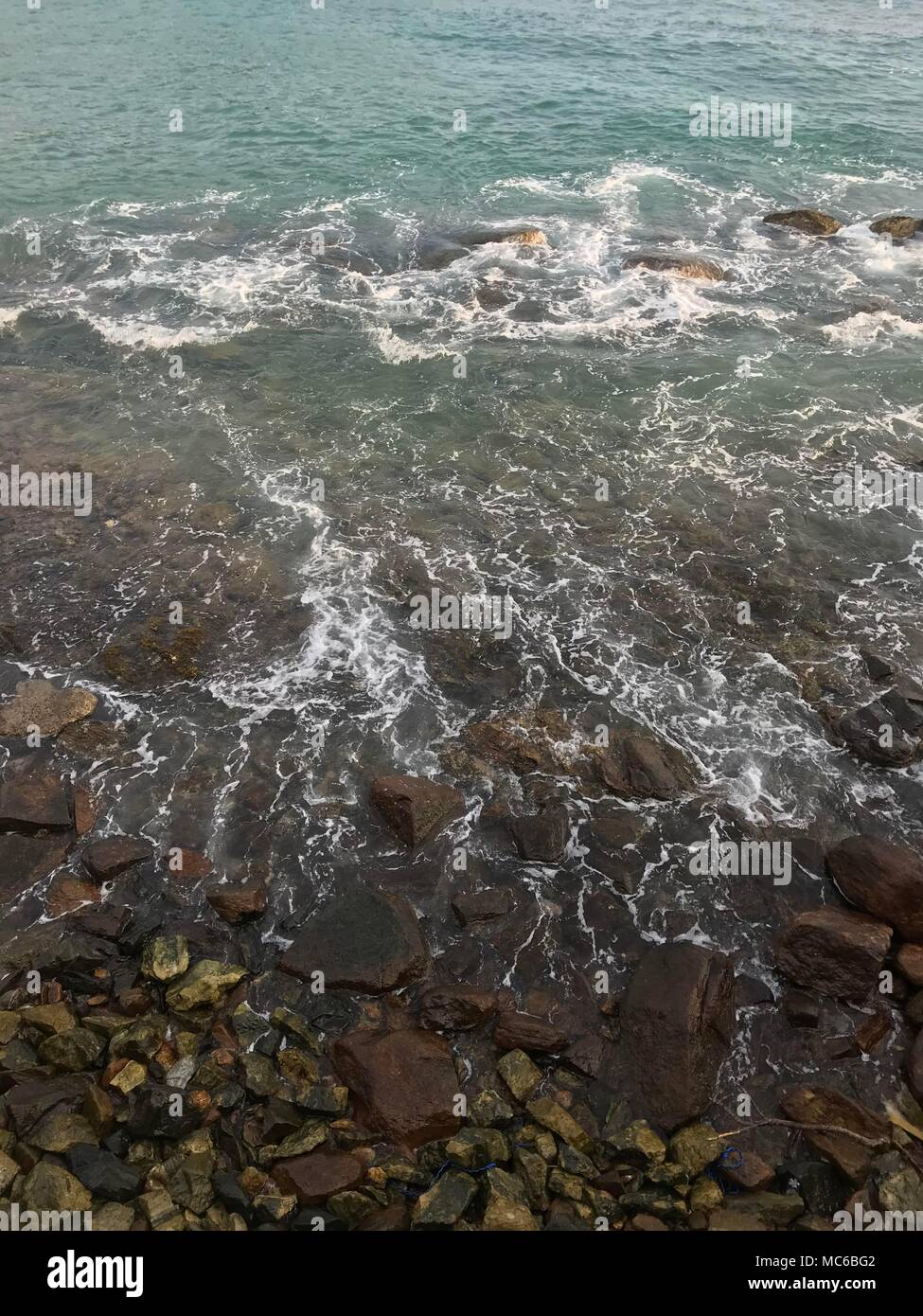 The waves of the ocean are washed by a stony shore Stock Photo - Alamy