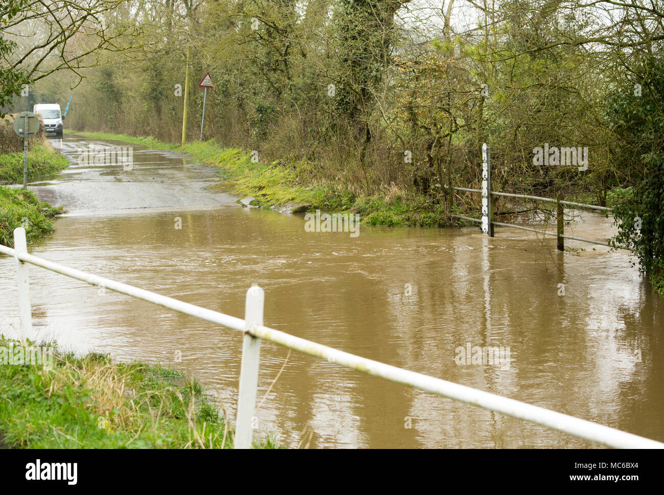 A crossing point at a river ford that is closed due to the river flooding after heavy rain, Dorset England UK Stock Photo