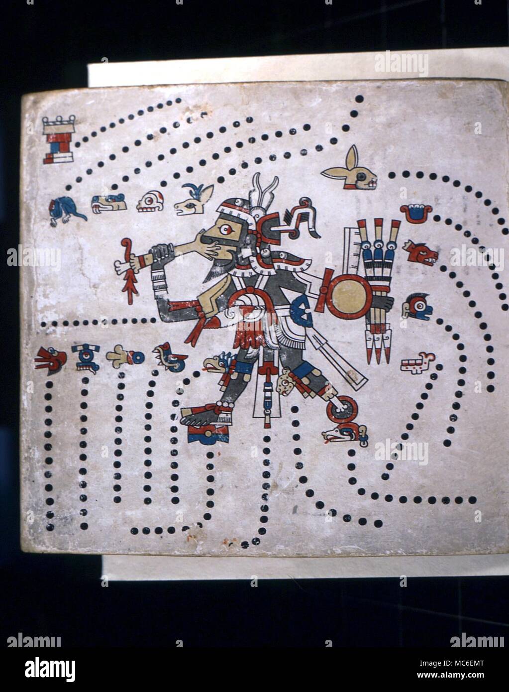 CALENDARS - Aztec Calendar The god, Tezcatlipoca, chief of the Aztec pantheon, with his missing foot, eating the palm of a sacrifical victim. He is surrounded by the symbols for the 20 day signs, the basis of the Aztec Calendar. From the Codex Fejervary-Mayer, Liverpool Stock Photo