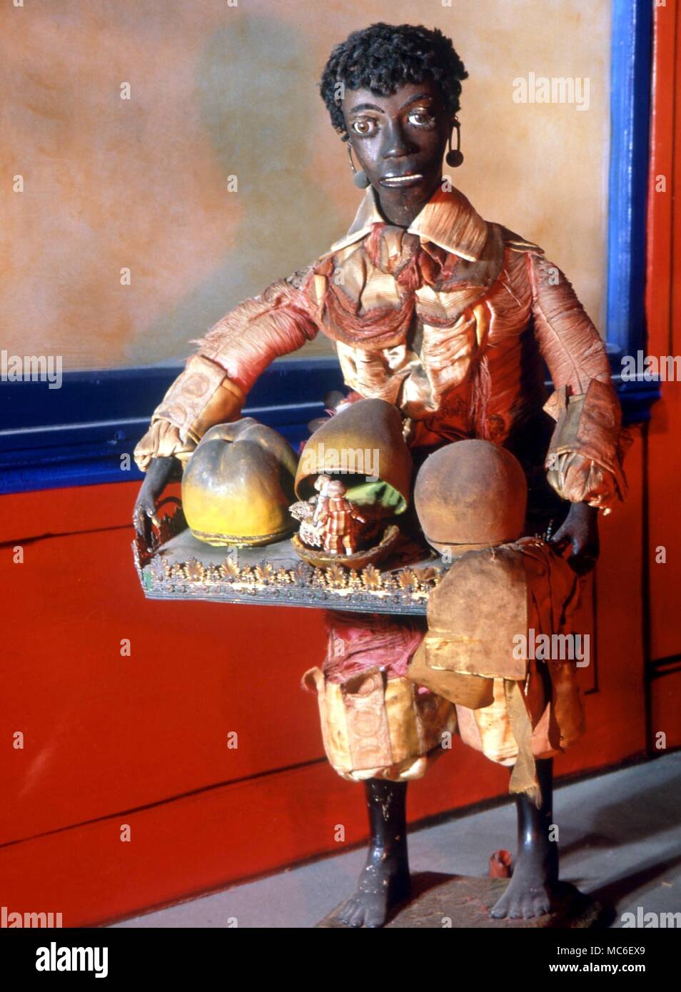 Fruit seller, by the Vichy Firm, c. 1880. Fruit seller blinks eyes, and fruits open to reveal monkey, waltzing couple and mouse running around in a circle. From the Museum of Automata, York Stock Photo