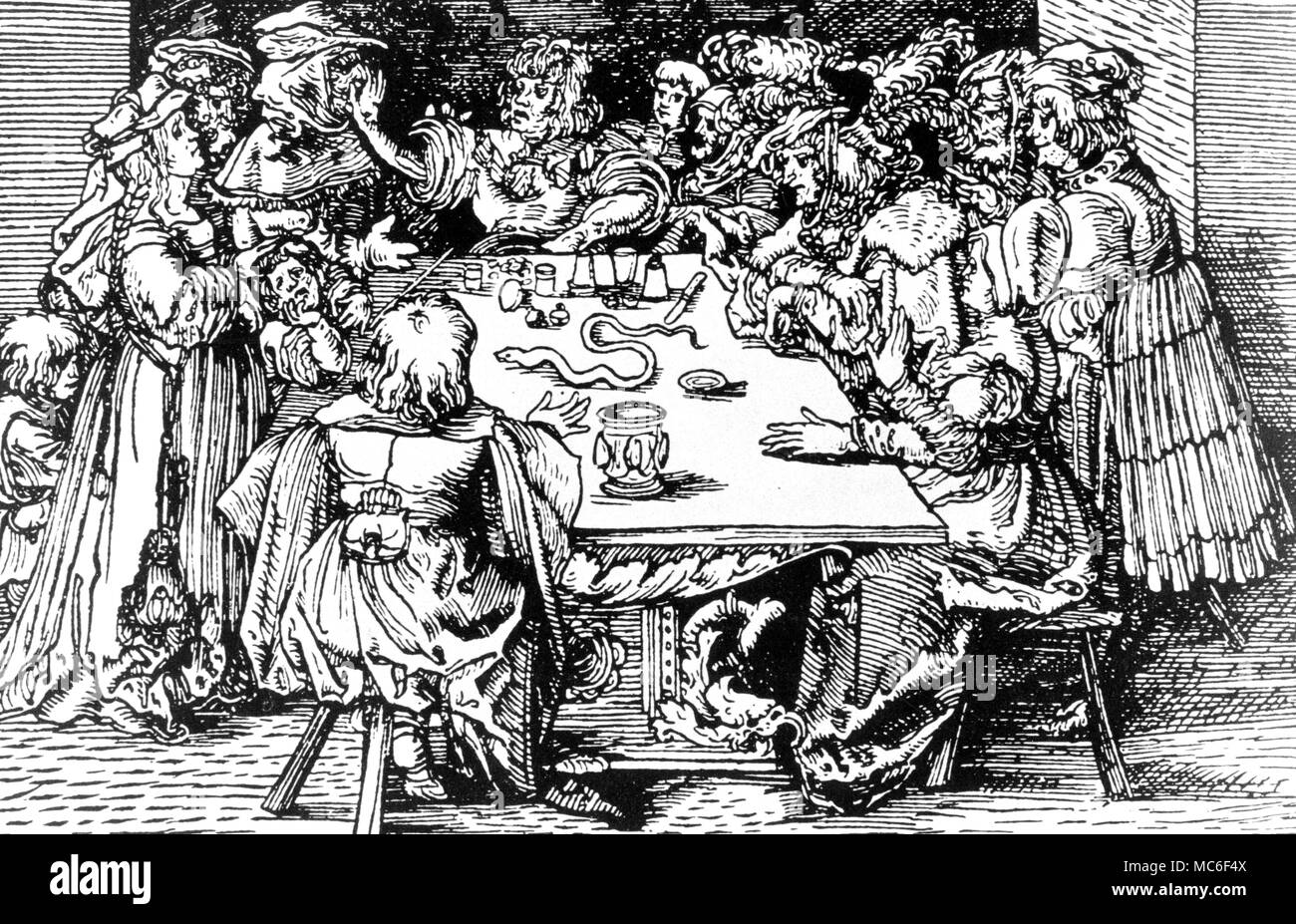 Conjurors working at a table. Illustration is woodcut from German illustration of Petrach's 'De Remediis Ultriusque Fortunae'', 1532' Stock Photo