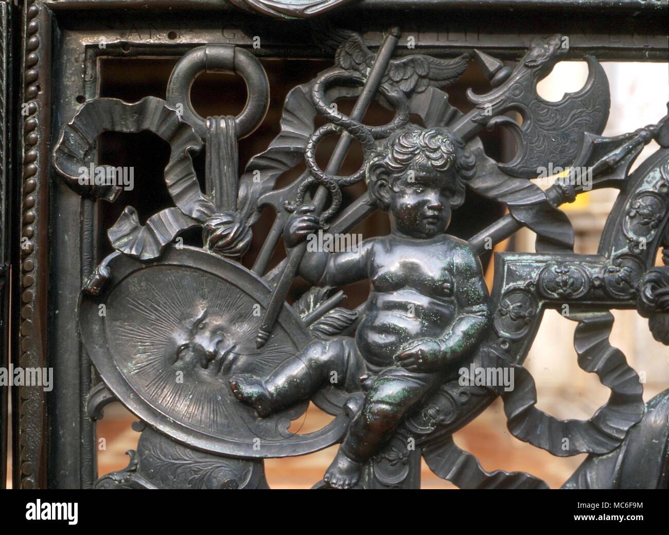 PLANETS - MERCURY Mercury (as child) with the caduceus, or wand of initiation. Detail of metalwork at the base of the Campanile of San Marco, Venice Stock Photo