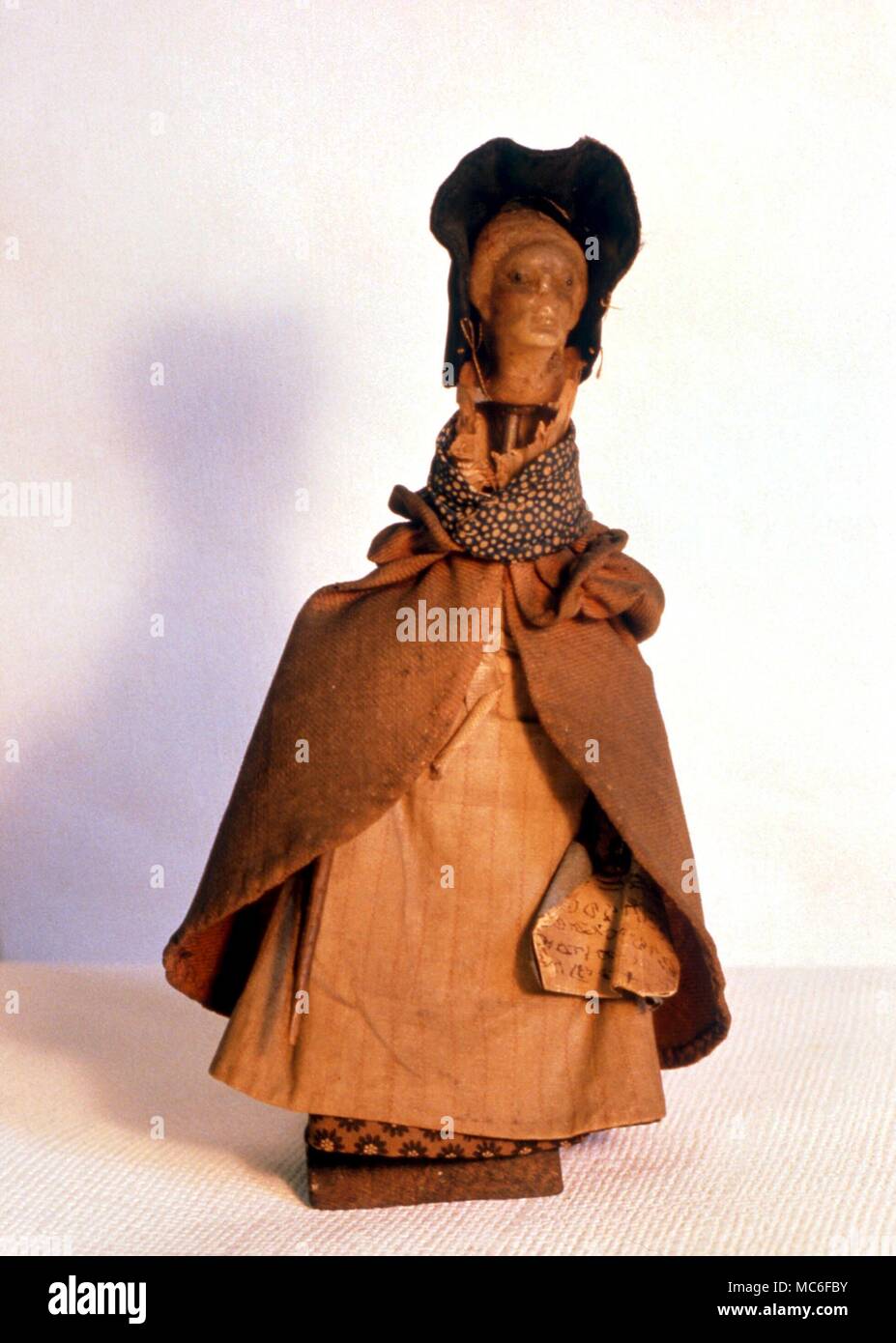 WITCHCRAFT - A witchcraft doll, or poppet, used by witches, who would name the doll (often by inserting a written name into the dress) and then mutilate it, to bring pain or death to the named victim Stock Photo