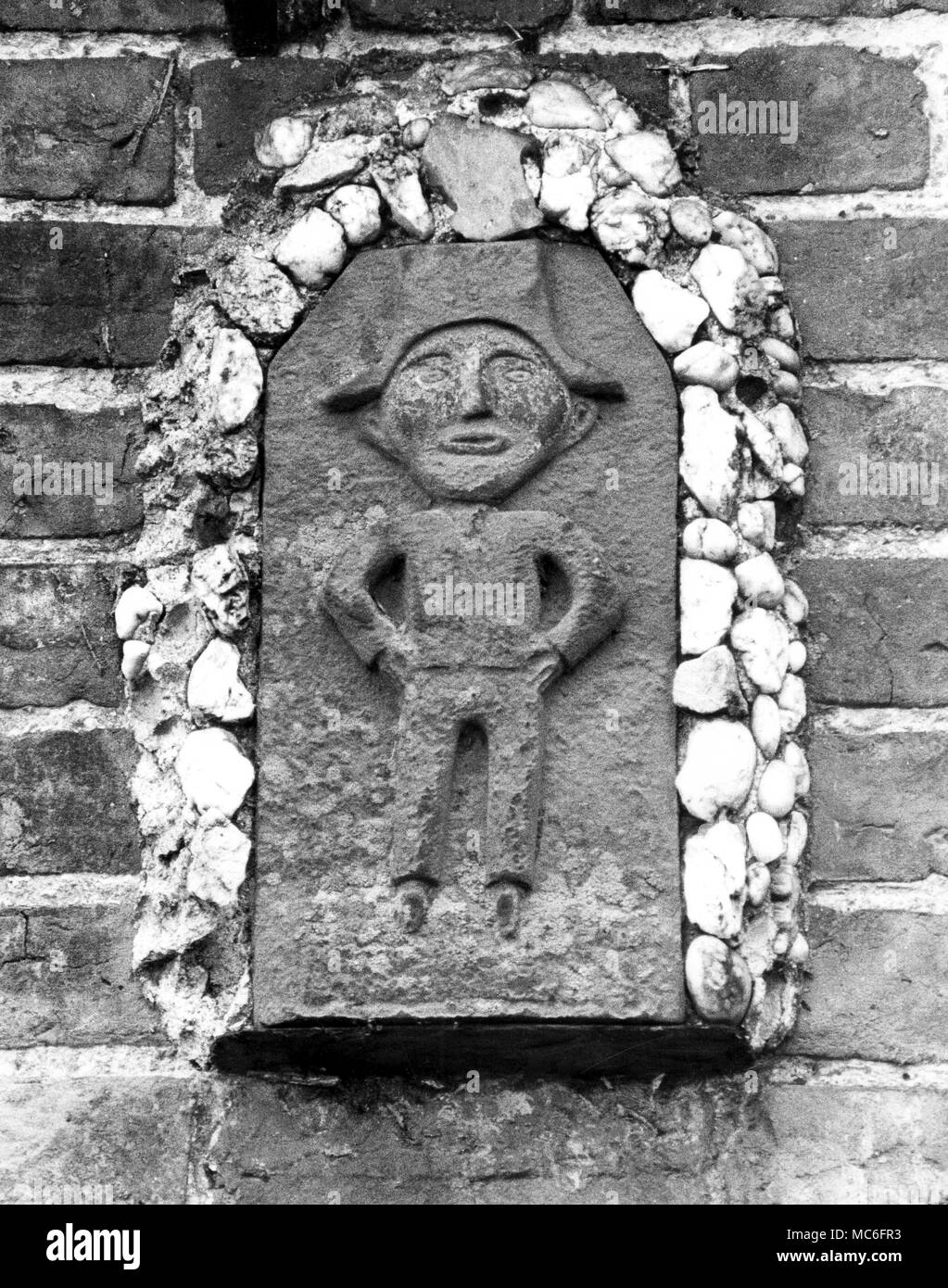 Bunbury, Cheshire - Detail of inset amuletic men in the so-called 'Images House' Stock Photo
