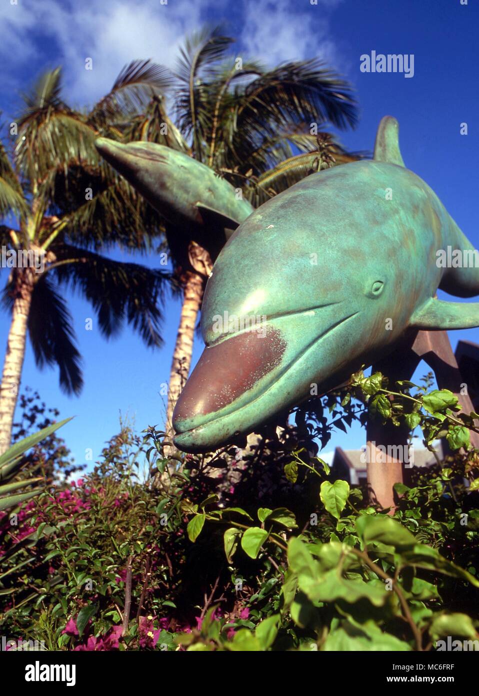 Bronze statue of leaping dolphin, near the seafront on the island of