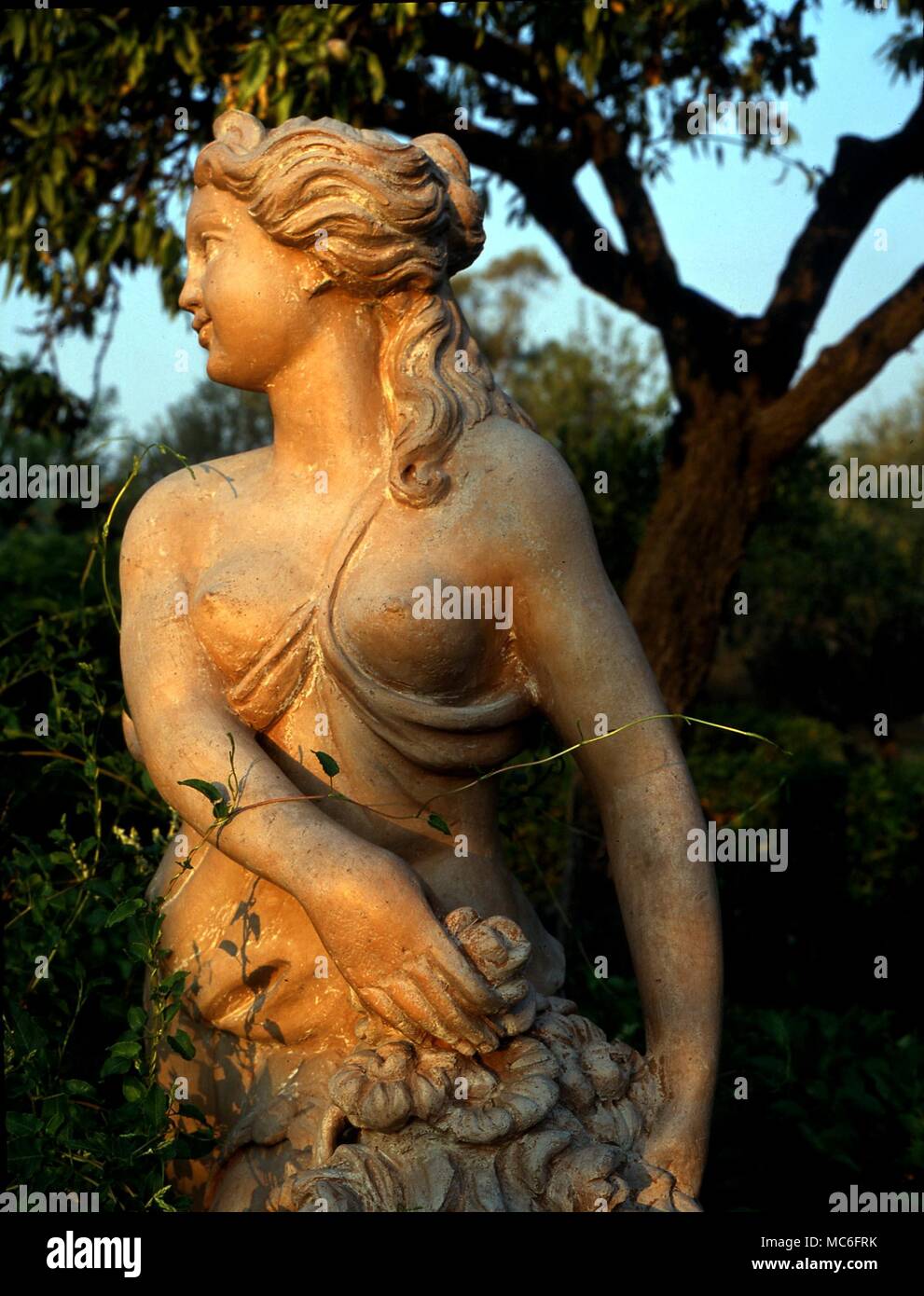 Statue of the goddess Flora in the archaelogical gardens around the acient temples of Afrigento, Sicily Stock Photo