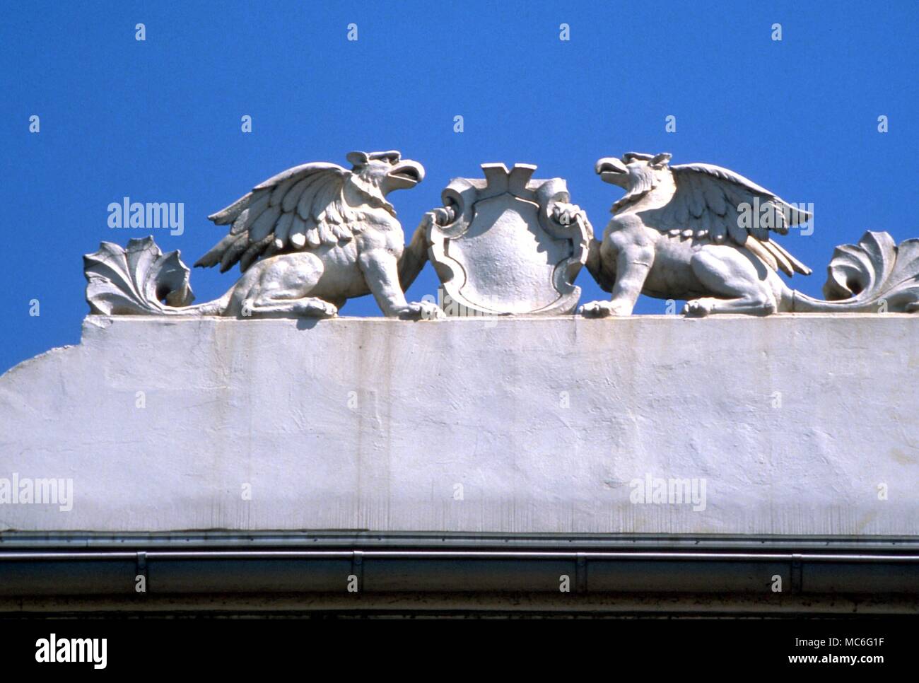 Pair of griffin supporters on top of a house in Rudesheim, Germany Stock Photo