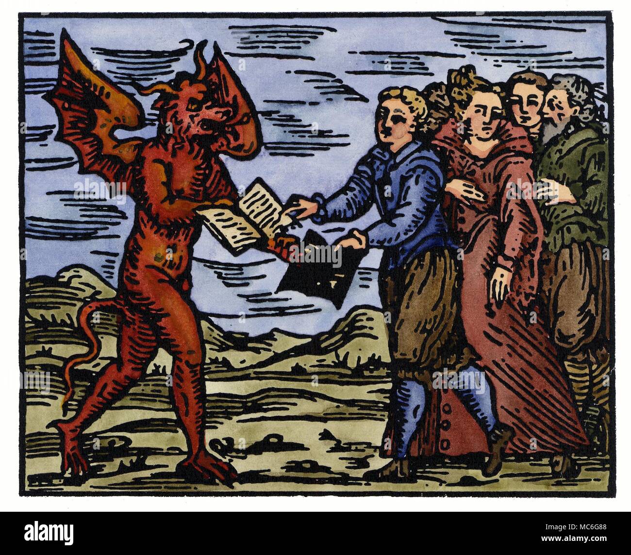 WITCHCRAFT - DEMONS The witches offering to the Devil a white book, in exchange for the black devil book. This symbolizes their wish that their names be struck from the Book of Life, and be inscribed in the Book of Death, kept by the Devil. Hand-coloured print from Francesco Maria Guazzo, Compendium Maleficarum, 1608. This was the most learned and precise of mediaeval witchcraft manuals, and in some respects (because it paid homage to the superstitions of the worst kind) one of the most horrible. Stock Photo