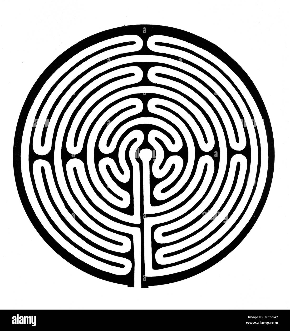 MAZES - THE ALKBOROUGH MAZE - JULIAN'S BOWER Ground plan of the mediaeval maze known as Julian's Bower, at Alkborough. The original turf maze is 12 metres in diameter [colour pictures of this maze are available in the Charles Walker archives]. The ground plan has been adopted for details in the masonry and stained glass of the local parish church, and even on grave-stones [colour images of all these are in the Charles Walker archives]. This is not a pure maze, for, once having embarked upon its pathway, there is no chance of becoming lost: the path leads inexorably to the inner circle. Stock Photo