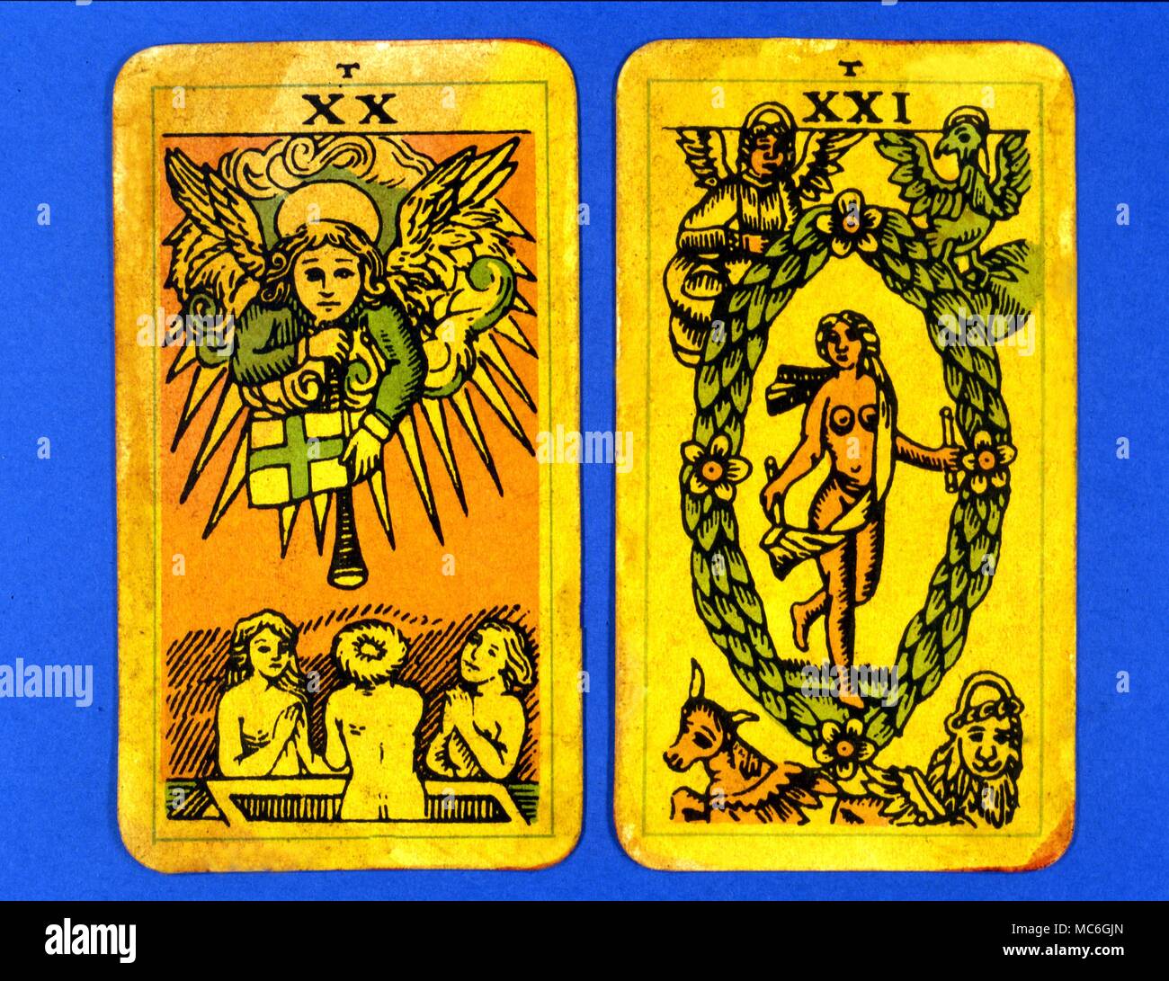Tarot Cards-Majo Arcana- The Parisian Tarot. Card 20. The Judgement, and Card 21. The World. Two cards from a Major Arcana picture Tarot,adapted by a Wiccan group. Probably designed in an archaizing style in loose imitation of the Rosicrucian deck designed by Pamela Coleman Smith, alongside A.E.Waite, and various earlier decks, such as that published by Encausse (Papus) in The Tarot of the Bohemians at the end of the 19th century, post 1905, but earlier than 1912. The name Parisian Tarot was given by the owner of the deck - it might however be called the Tau Tarot, from the intriguing letter Stock Photo