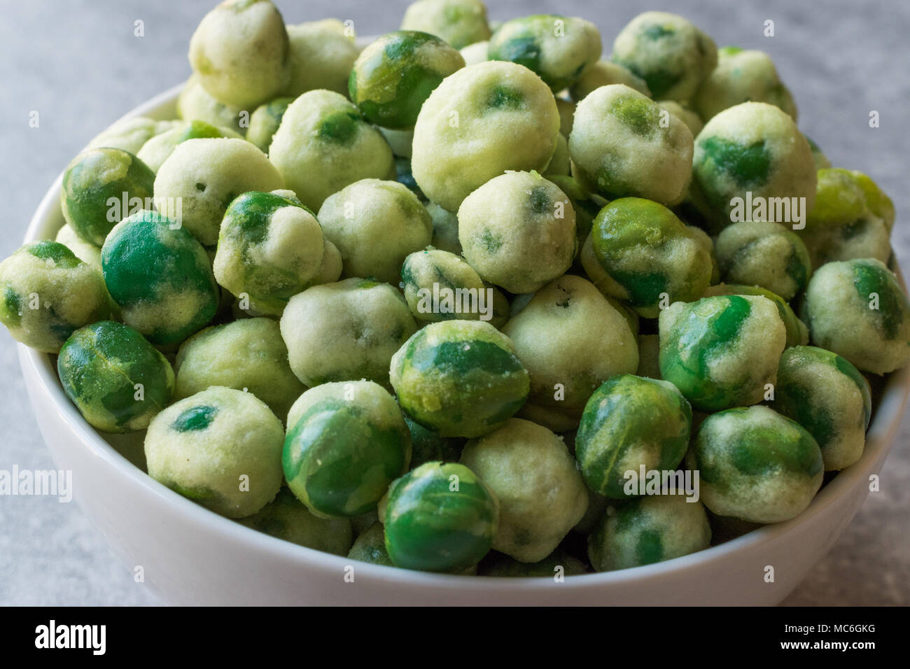 Crispy Dry Spiced Green Wasabi Peas as an Appetizer. Organic Food Stock
