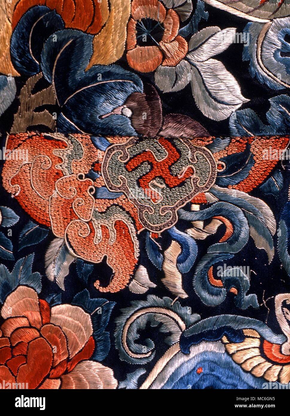SWASTIKA Sauwastika as a Buddhist symbol, on a silken robe embroidery (19th century) formerly used in the Chinese court. Private collection, Hong Kong Stock Photo