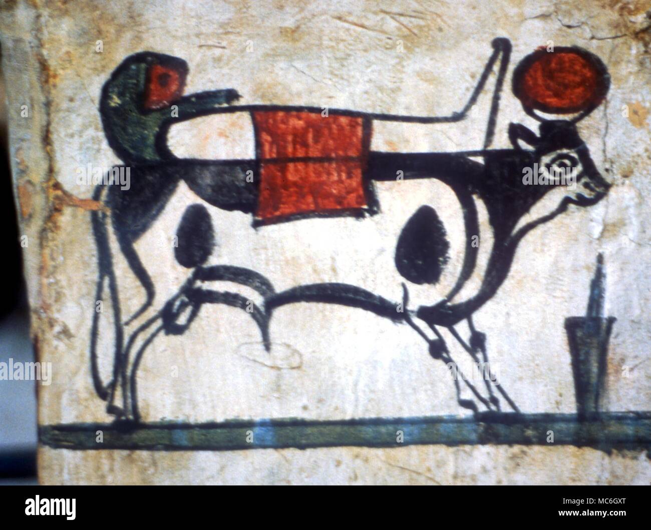 EGYPTIAN MYTHOLOGY- Mummy of the recently deceased carried on the back of the sacred bull. Detail of painting on Middle Kingdom mummy case Stock Photo
