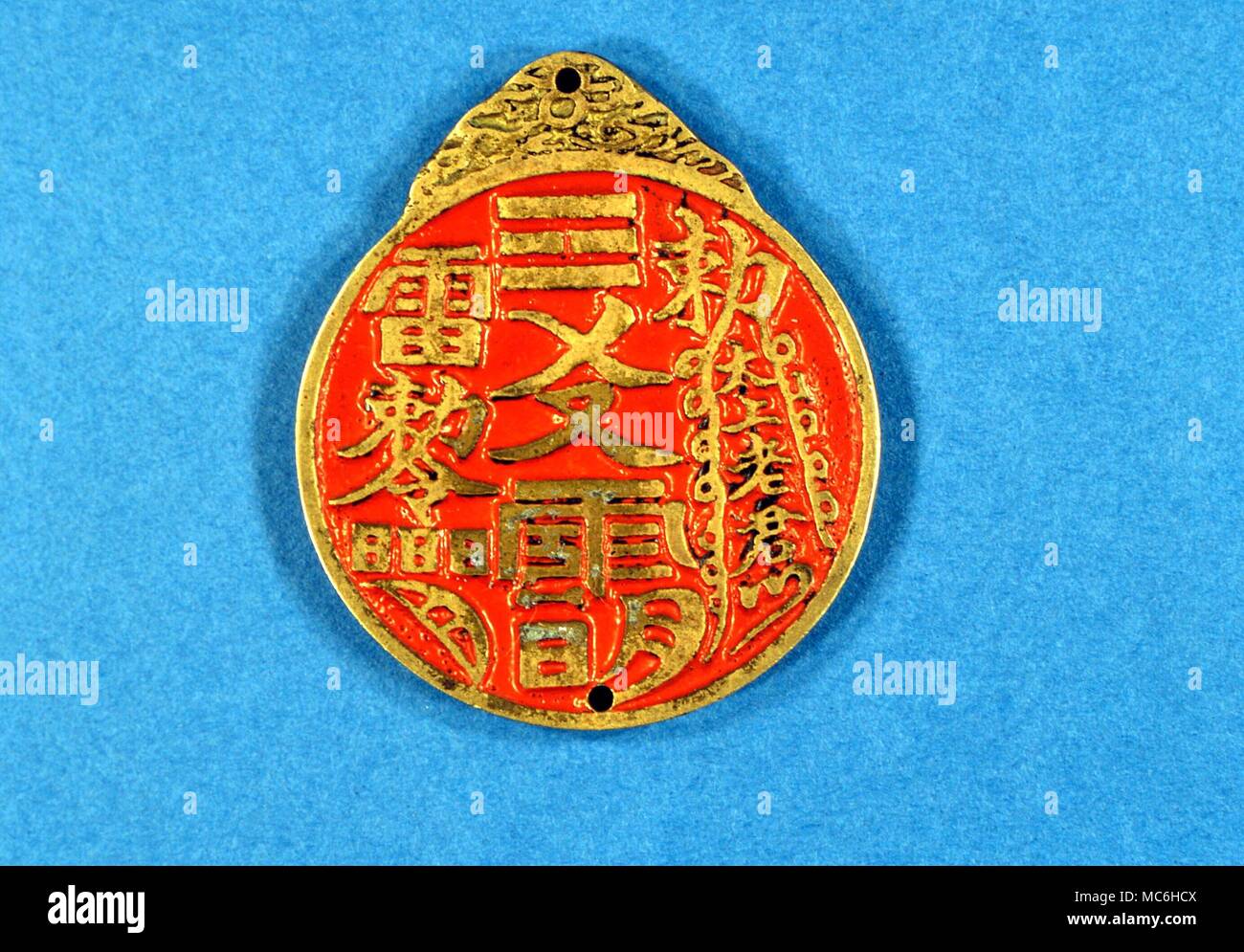 AMULETS - Back of a Tai Chi image, with the eight trigrams, designed as a charm against evil spirits Stock Photo
