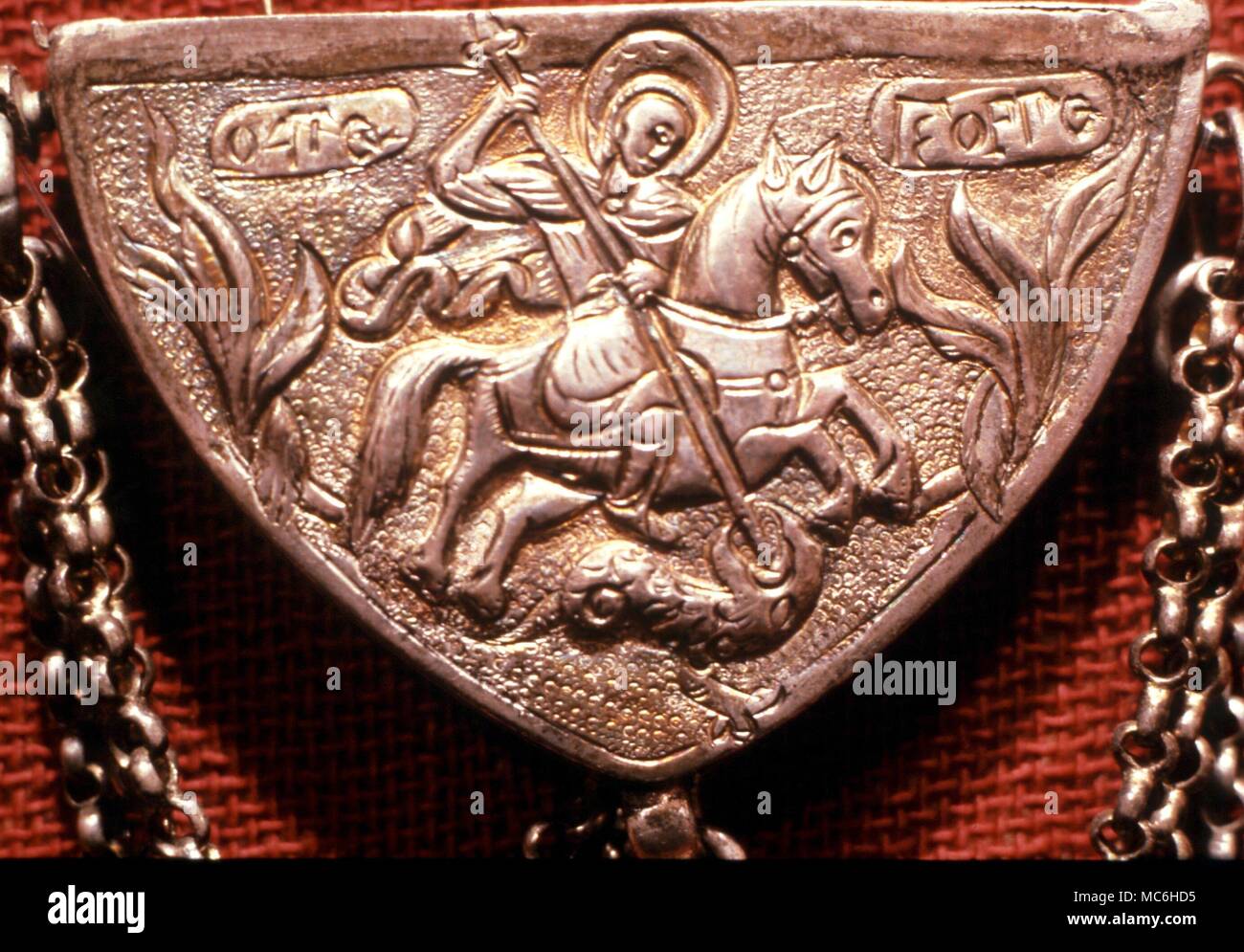 AMULETS - Amulet case (19th century) with image of St George and dragon. From the Folk Museum, Athens Stock Photo