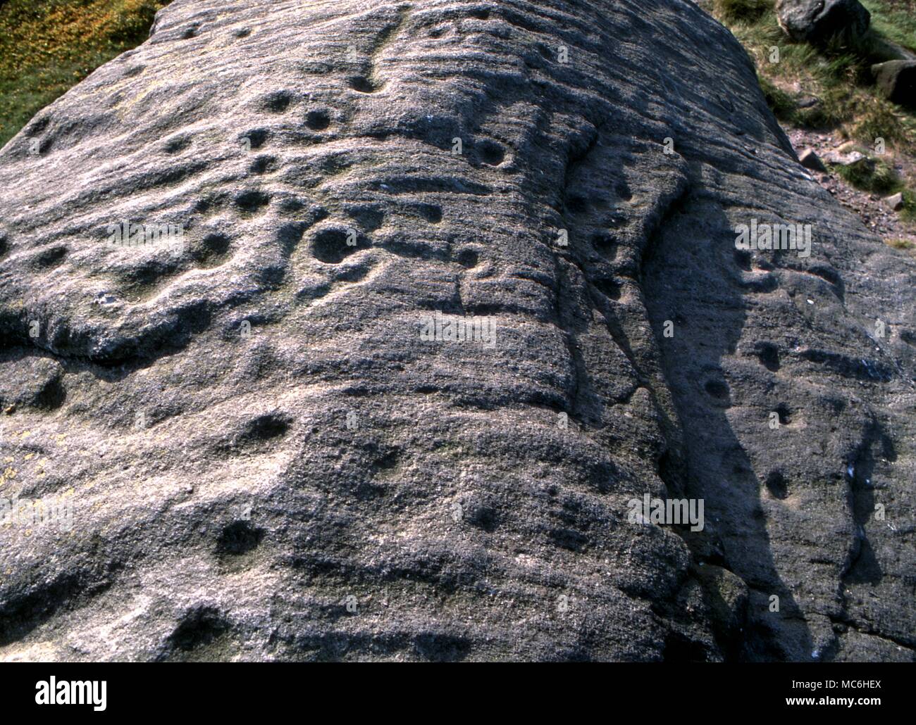 Ley Lines. The Pancake Stone on the ridge above the Cow and Calf on Ilkley Moor, Yorkshire. Prehistoric symbols. Stock Photo
