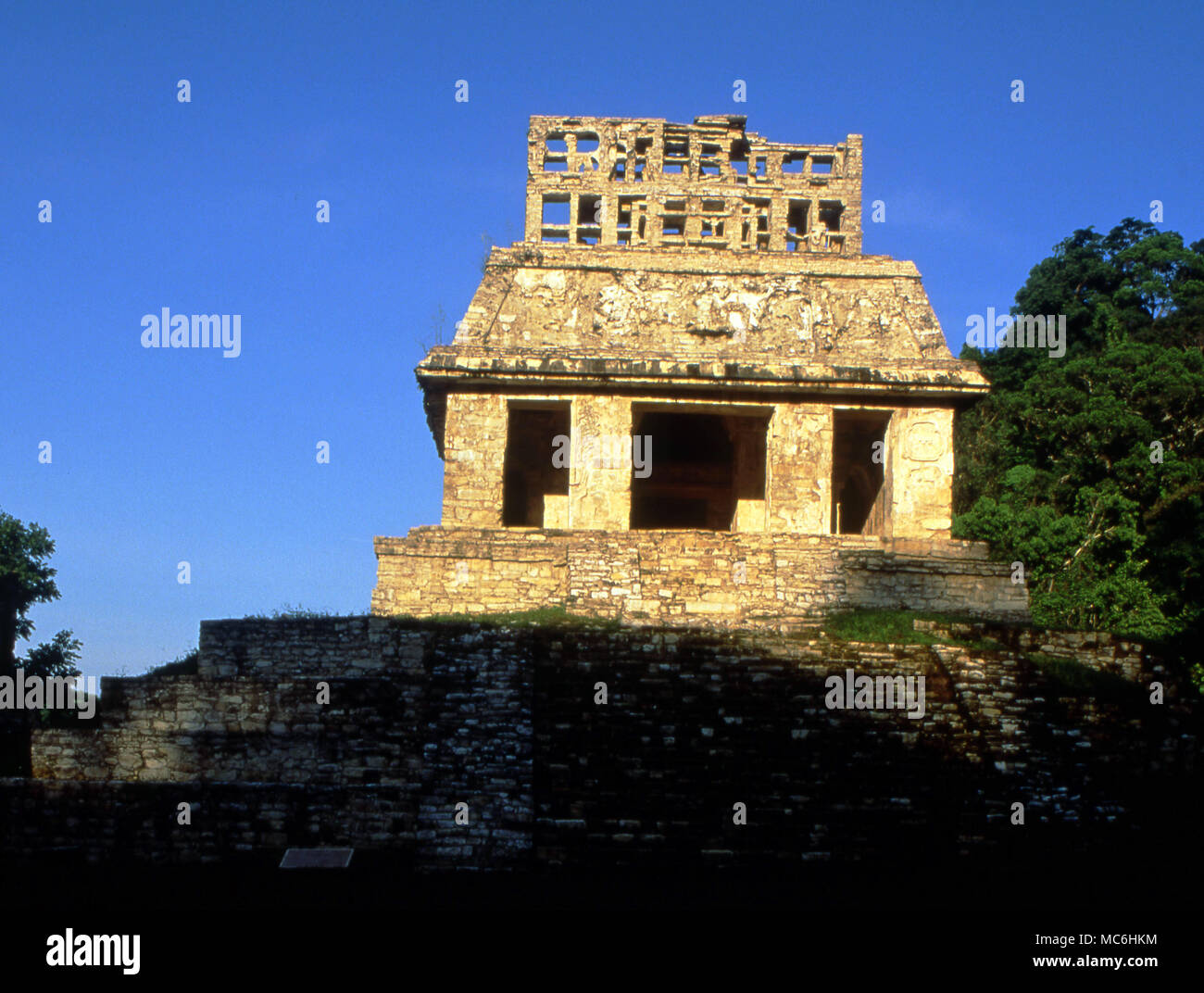 Mexican Archaeology. Palenque Pyramid Temple of the Sun with a well preserved crest. At the rear is a carved solar panel in limestone. Stock Photo