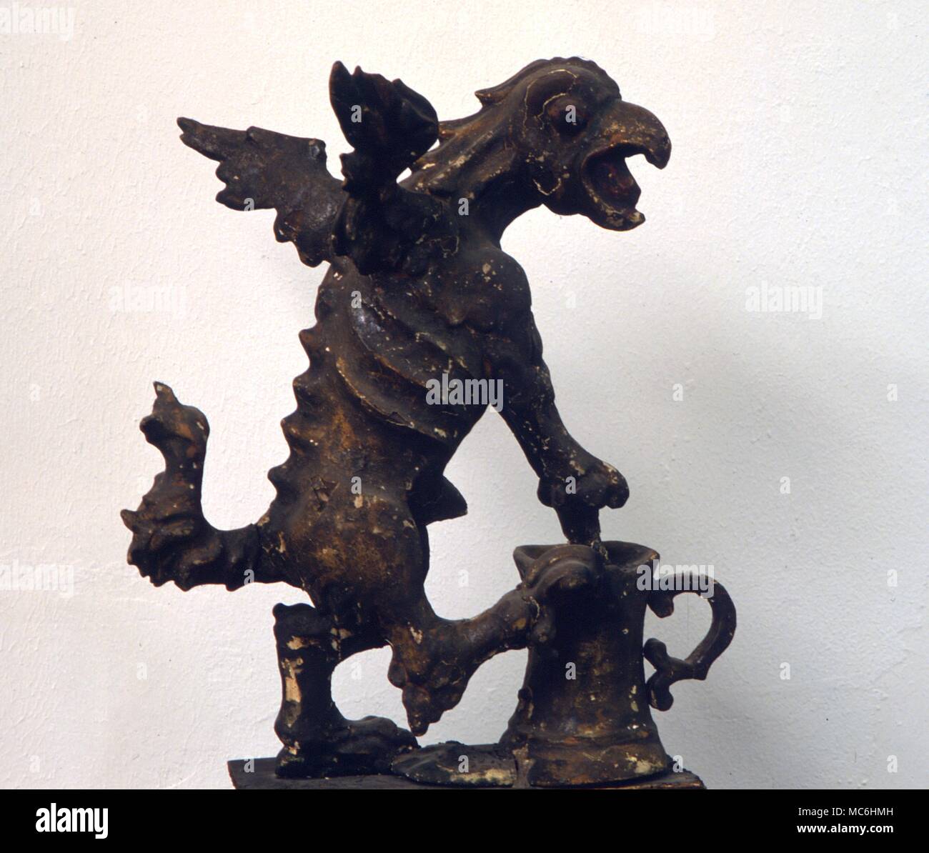 Medical. Mediaeval mortar and pestal in the form of a dragon on display in the Swiss Museum of Pharmaceutical History, Basle. Stock Photo