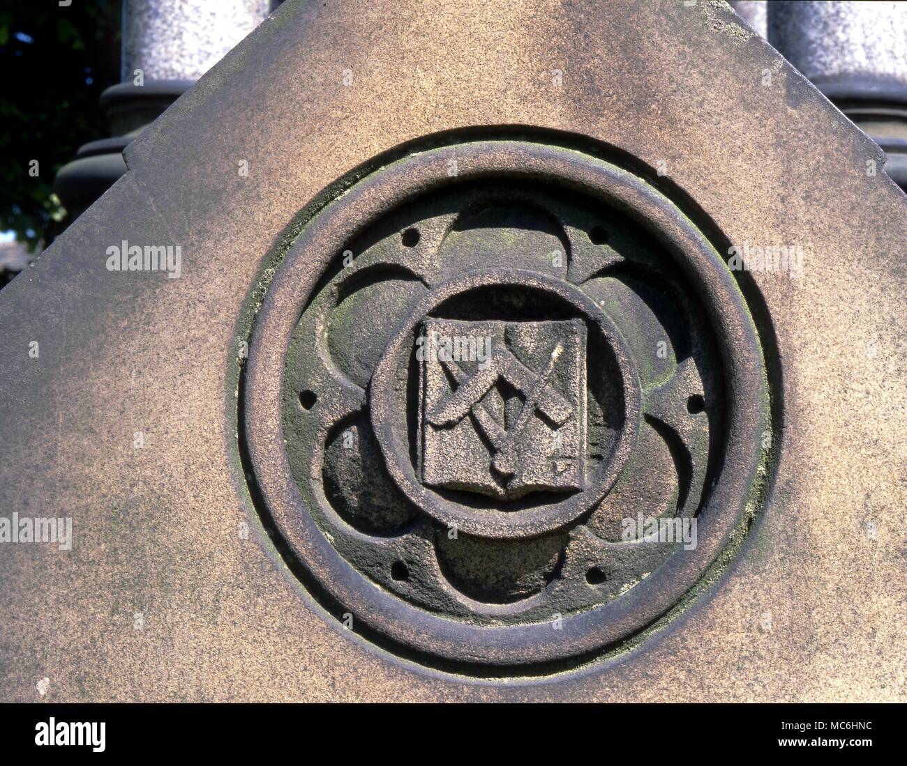Masonic symbols on the 19th century tomb in the graveyard of Littleborough Parish Church. Stock Photo