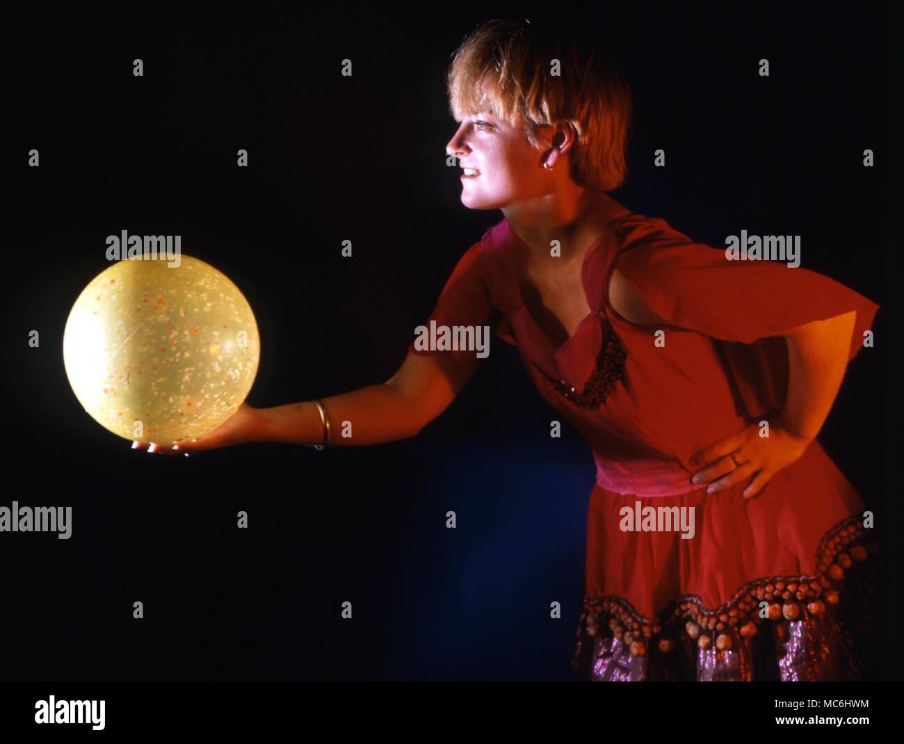 Stage Magic. Throwing things into thin air. The ball disappears when thrown. Stock Photo