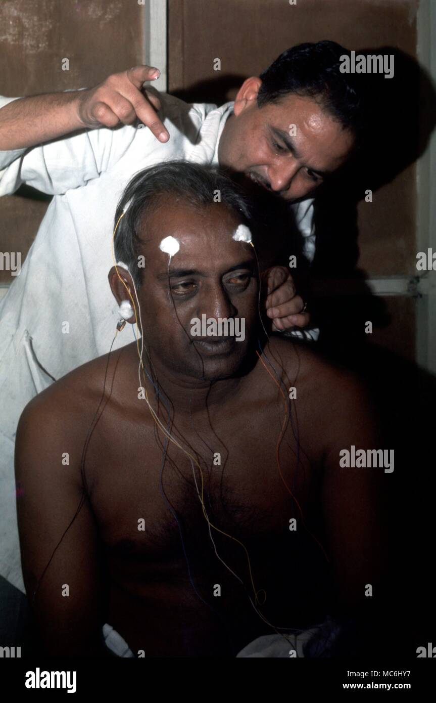 Scientific Curiosities Ramanand Yogi being prepared for scientific testing relating to his ability to consciously change various body rhythms Stock Photo