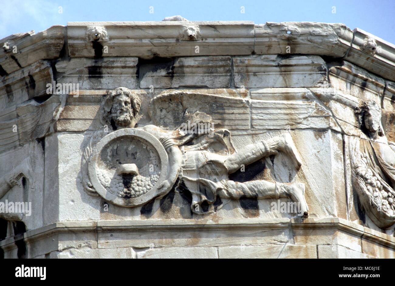 Greek Mythology The Winds Detail of one of the personifications of the Winds on the southern facade of the Tower of the Winds in the Roman Agora at Athens Stock Photo