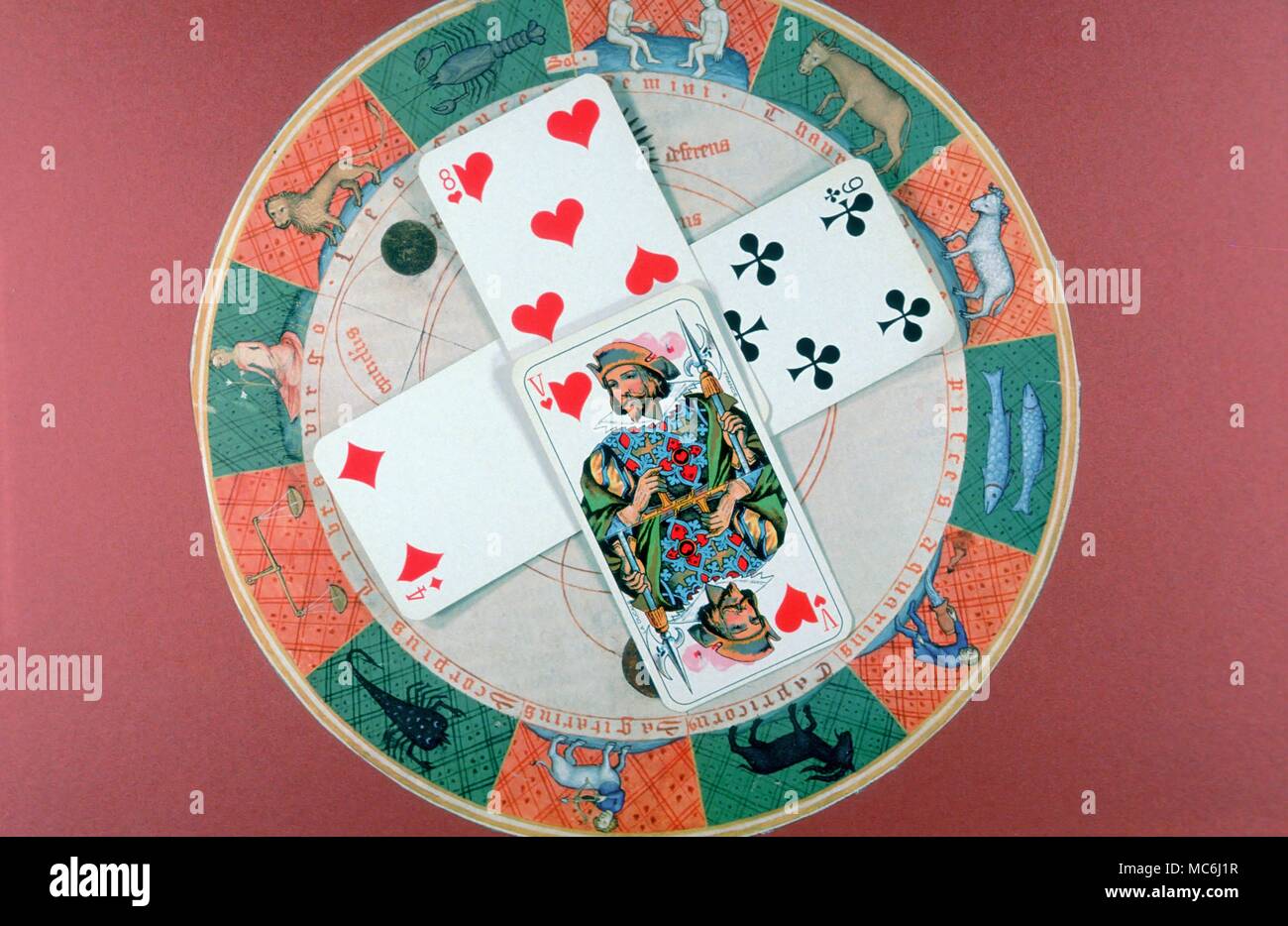 Cartomancy A formal order of Cartomancy with the four cards set out in order to reveal questions about personality relationships career and home Based on the four angles of the horoscope Stock Photo