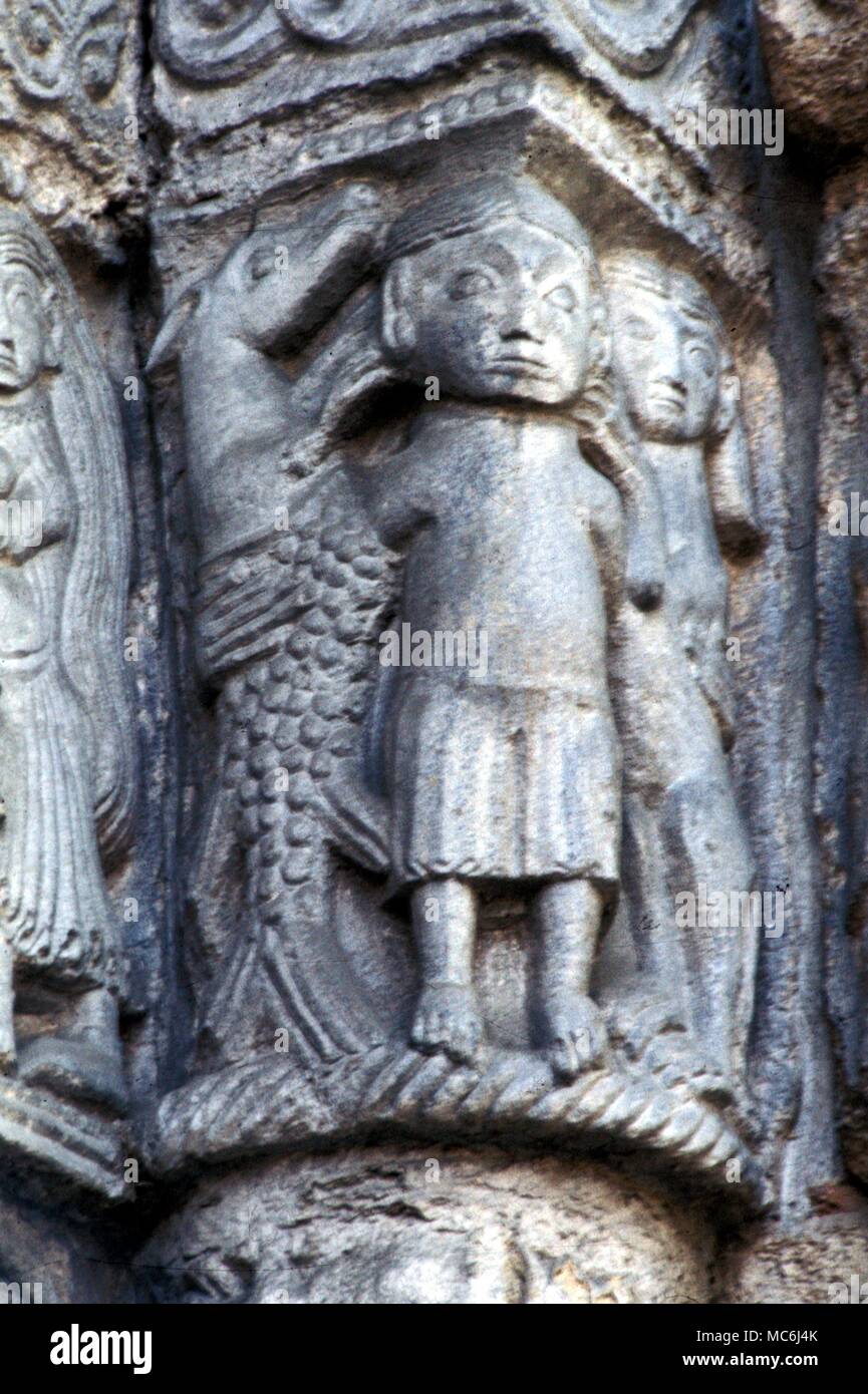 Hippocampus rearing alongside a man Detail from the facade of the church of St Michele Pavia Italy Stock Photo