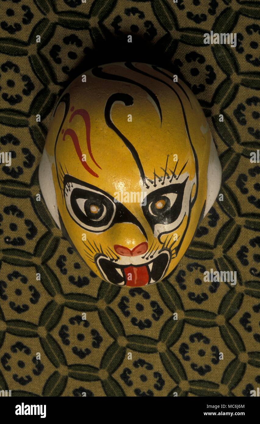 Chinese Astrology Mask personifying the zodiacal or calendrical animal the Tiger Each of the twelve animals has a traditional personification image which is painted on ritual masks Mask purchased in Beijing Stock Photo