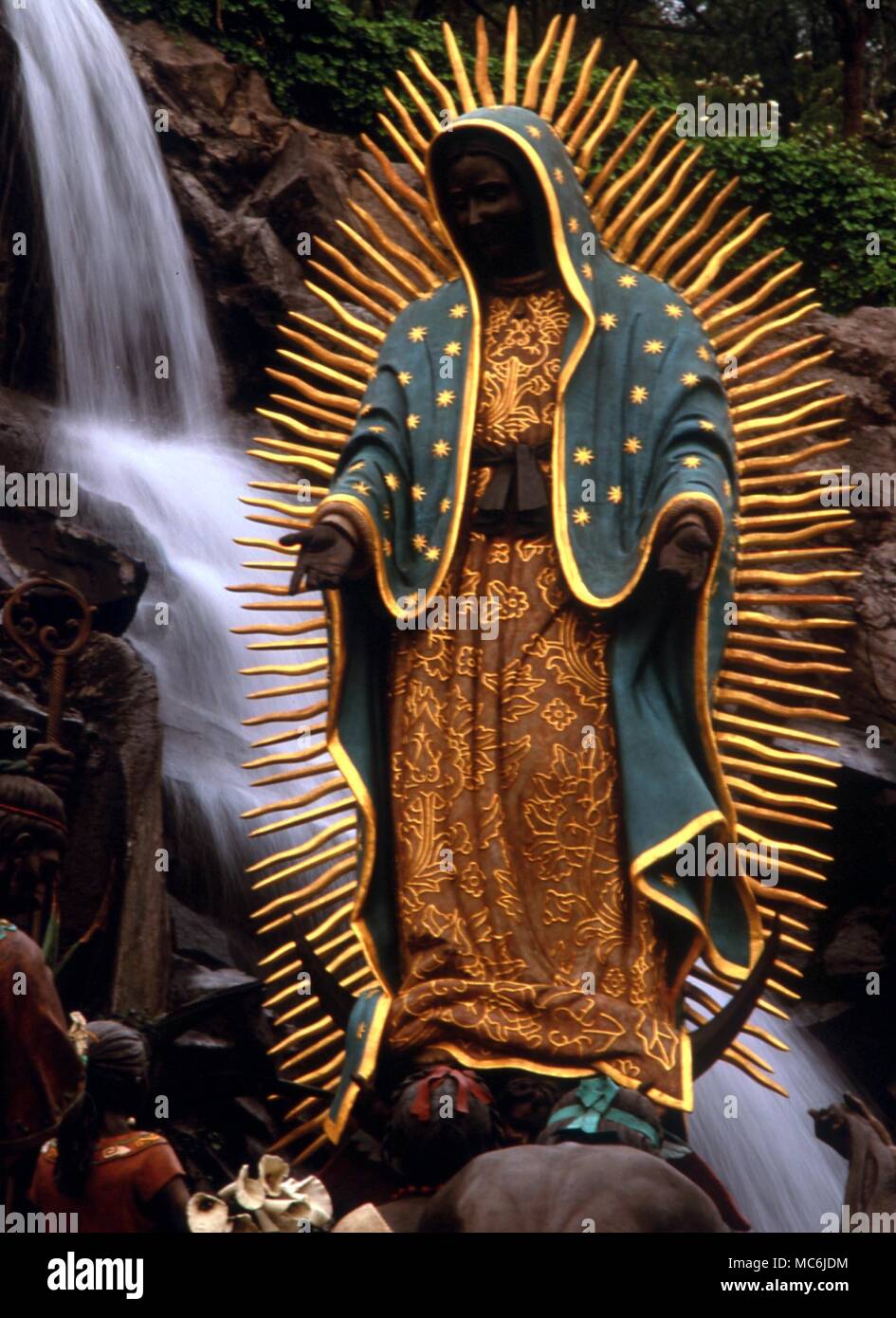BLACK VIRGINS - GUADALUPE. the radiant image of the Black Virgin of Guadalupe at Villa Guadalupe, Mexico City. The virgin is said to have appeared four times to Juan Diego, in 1531. Annual ceremonial of Las Mananitas, on 12 December Stock Photo