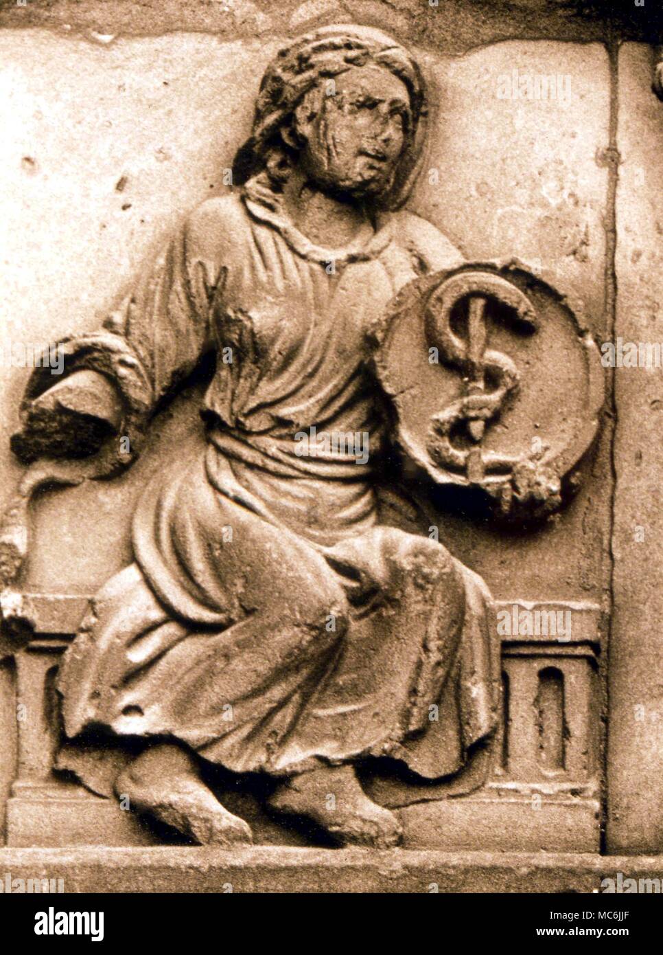 ALCHEMY - PHILOSOPHIC MERCURY. The Mercury of the Alchemists, on a shield held by woman - a thirteenth century relief on the facade of Notre Dame, Paris Stock Photo