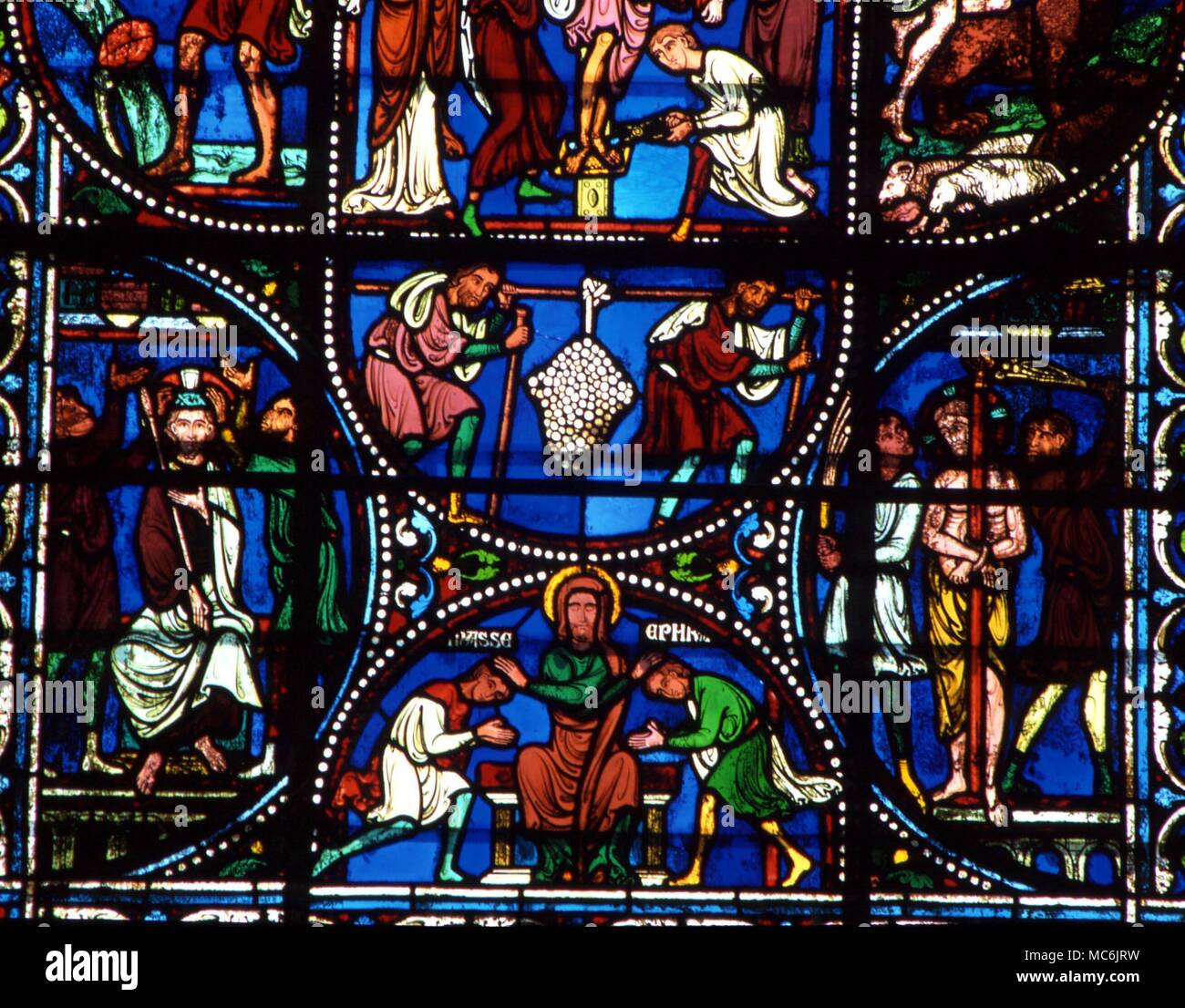 MASONIC. Registration (bottom register) of the Masonic five-fold greeting of Brotherhood (mediated by Christ) Stained glass in the church of St Pierre, Chartres Stock Photo