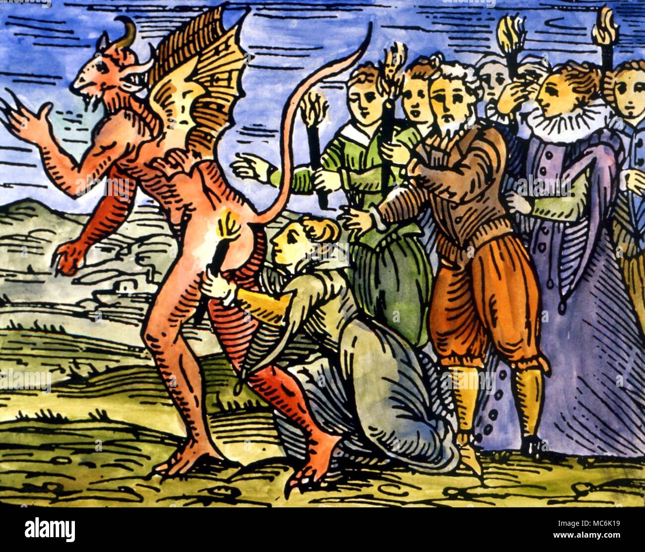 DEMONS - Demon, or demon-king, at a Sabbat. The newly induced witches are makiing the Satanic kiss, on the posterior of the devil. From Guazzo's 'Compendium Maleficarum', 1608 Stock Photo