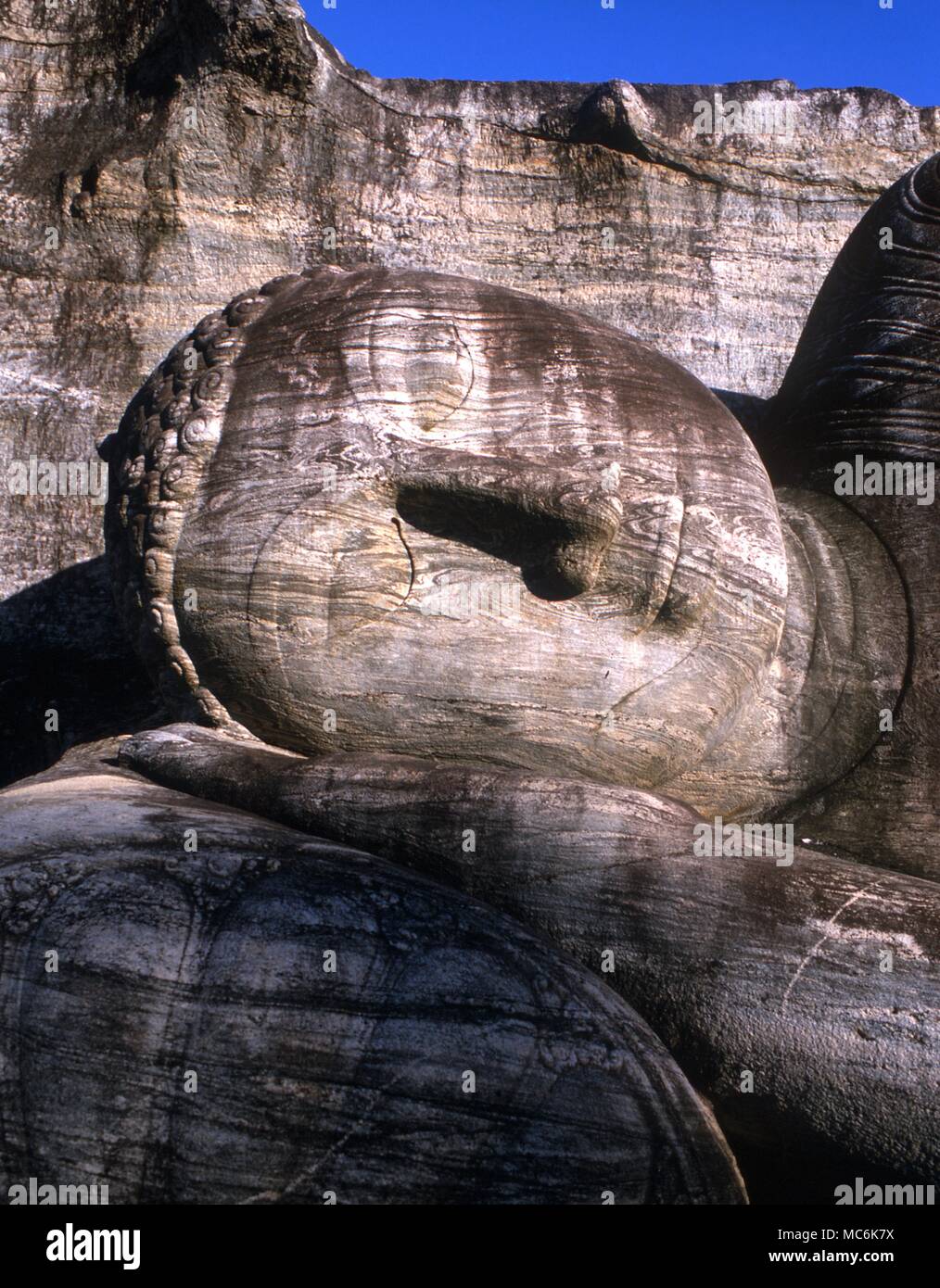 Sri Lanka Polonnaruwa Ancient City Gal Vihara colossal Buddhas carving in the granit boulders recumbant image is 46 feet long standing is 23 feet high Stock Photo