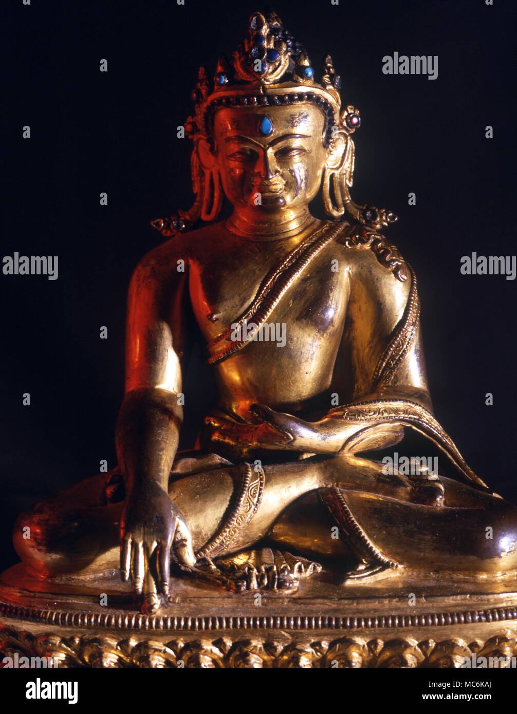 Sakyamuni Buddha in classical earth touching mudra. The third eye suggests that he is a celestial form rather than the historical Gautama Stock Photo