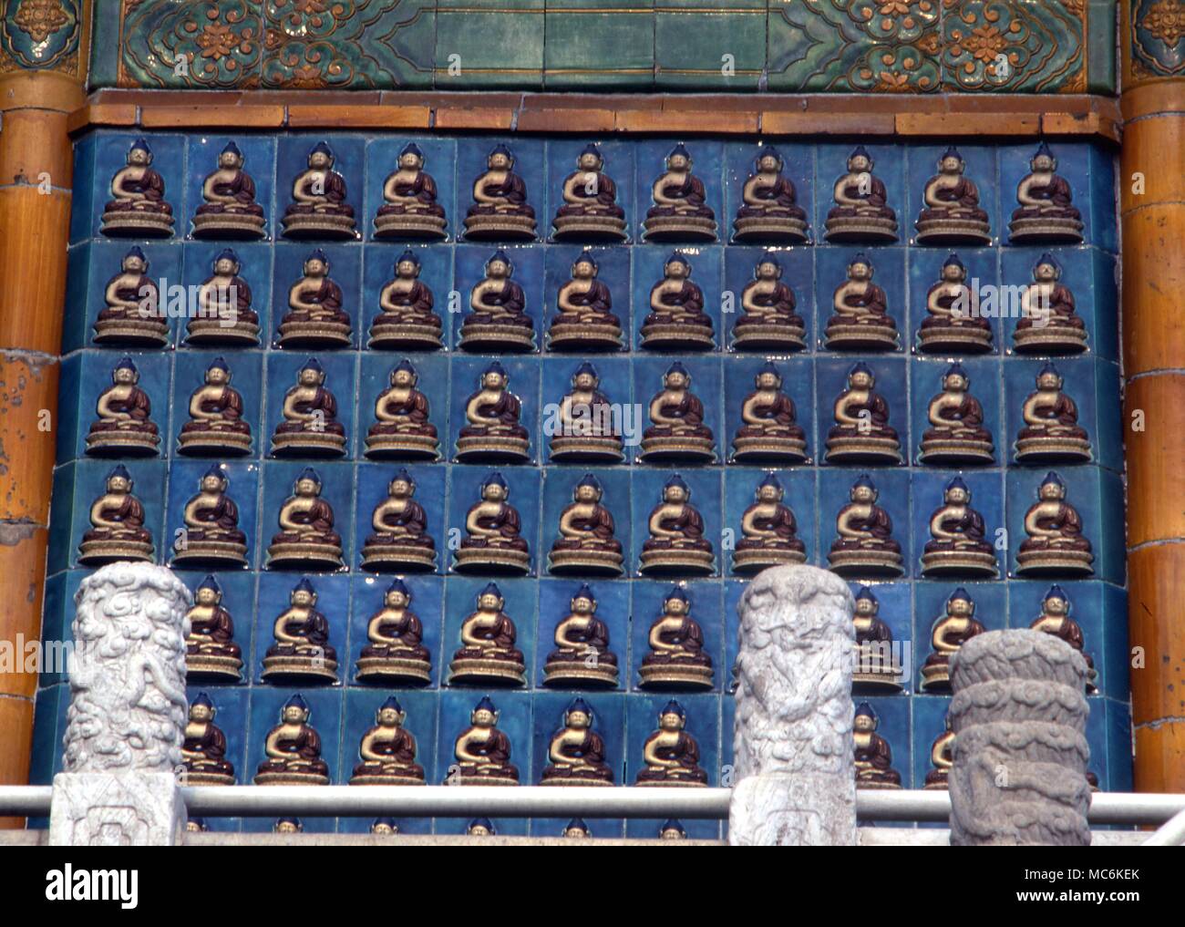 Buddhism Buddhist statues ceramics on the exterior wall of the temple at the top of the main temple in Bei Hai Park Beijing China Stock Photo