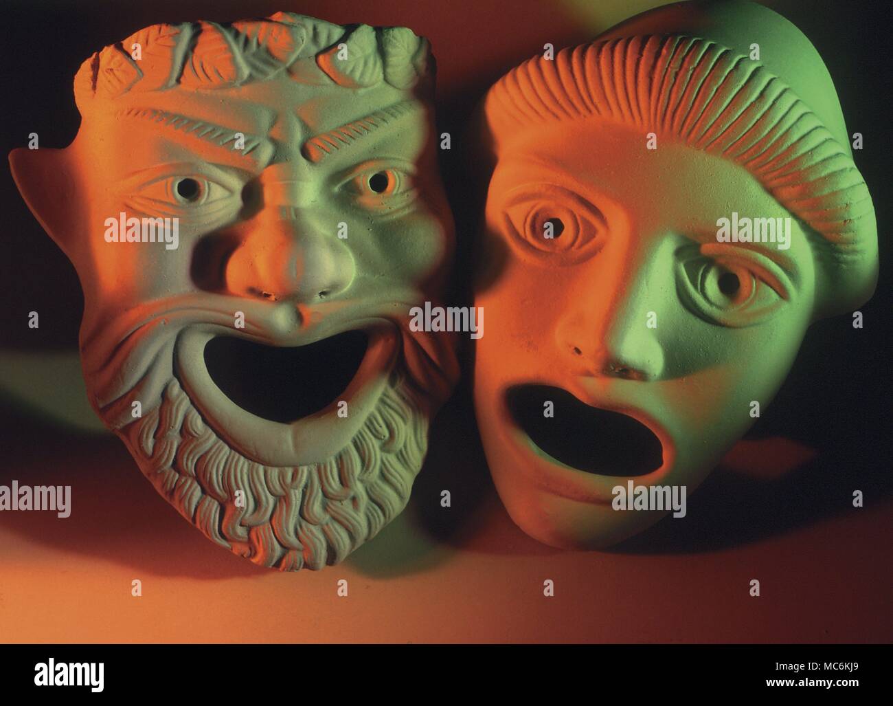 Greek actors' masks. Pair of theatre masks, based on ancient Greek originals: sometimes called Comedy and Tragedy Stock Photo