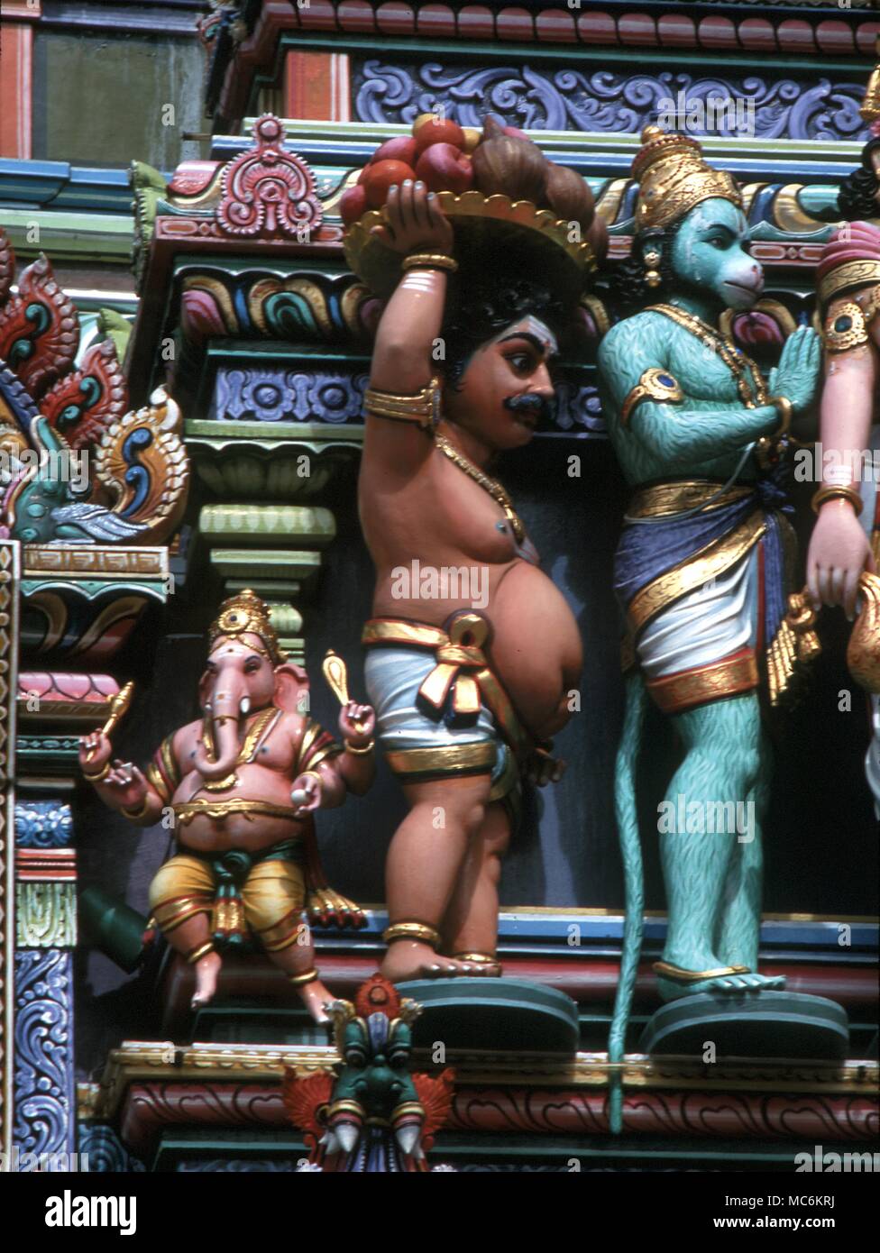 Hindu Mythology. Ganesa, elephant-headed god of wisdom with Vamana, the dwarf and Hanuman, the monkey-god. Hindu temple in Singapore Stock Photo