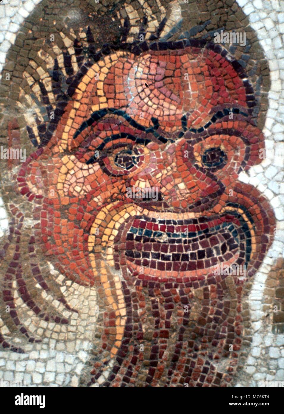 Masks. Mosaic of Greek tragedy mask, from a restored ancient Greek pavement near Argos, Greece. Stock Photo