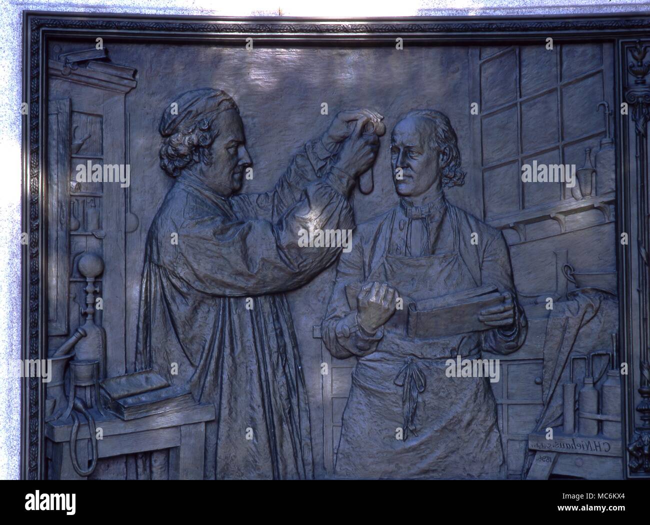 Homeopathy - Hahnemann. Samuel Hahnemann (1755-1843) as a chemist. Bas-relief from the Hahnemann memorial by C.H.Niehaus in the Scott Circle, Washington DC Stock Photo