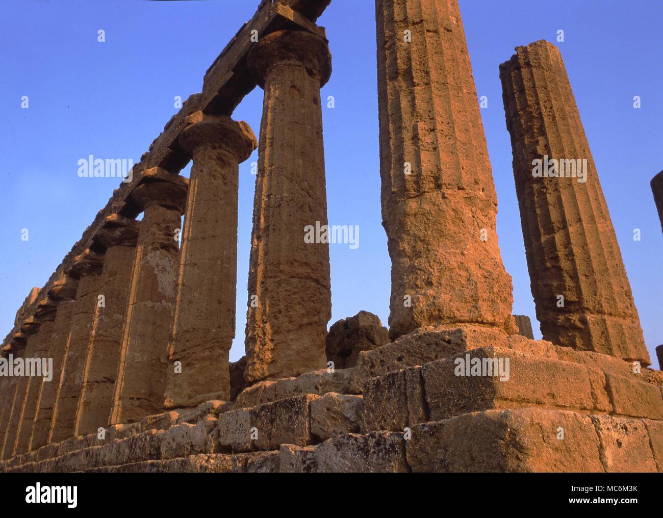 Light Mysteries. The Temple of Juno at Agrigenio, Sicily was nuilt c.440BC.The shot has been taken to show how the first rays of the sun in August strike the east end of the temple. Stock Photo