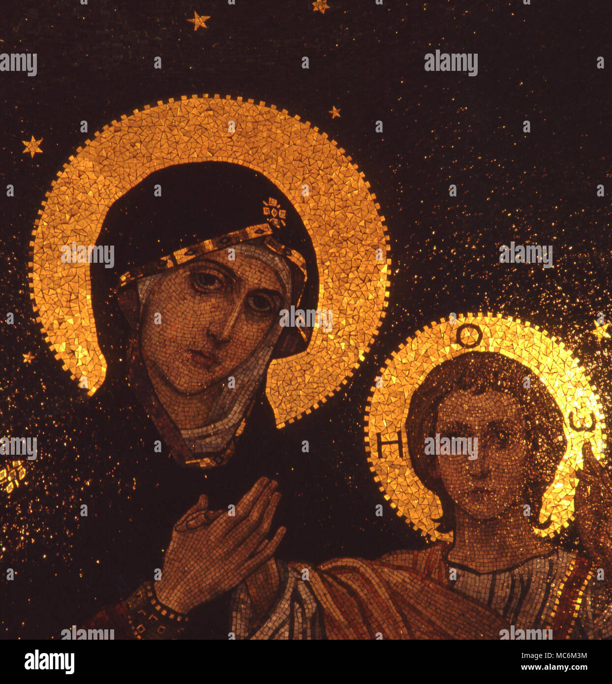 Light Mysteries. Halo of the Christ child mosaic, lit so that the halo remains bright from any position. In the Russian Orthodox chapel in the Mathildenhohe in Darmstadt. It was built for Czar Nicholas II. Stock Photo
